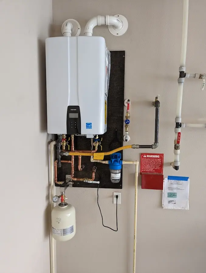 Professional plumber installing copper piping in a Shawano home